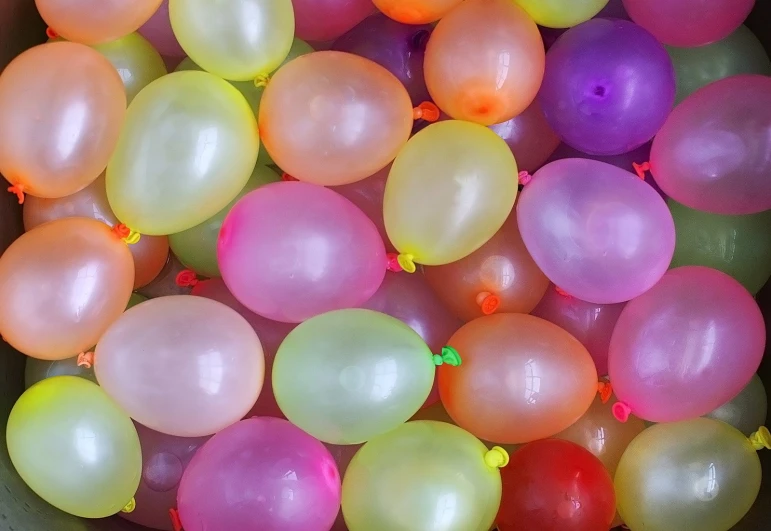 the balloons are in a small plastic box