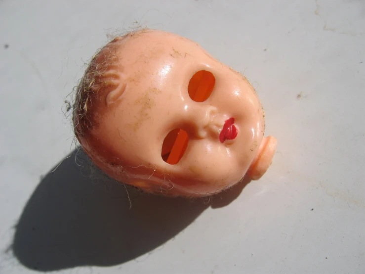 the head and nose of a doll