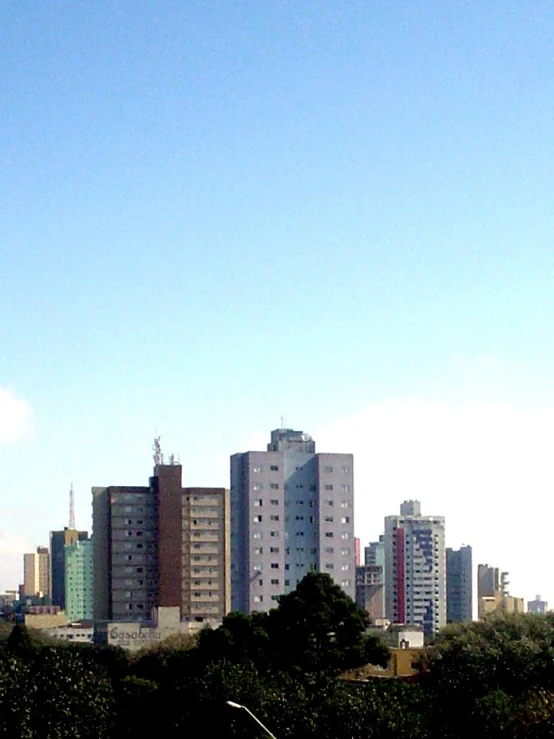 a plane flying low to the ground over a city