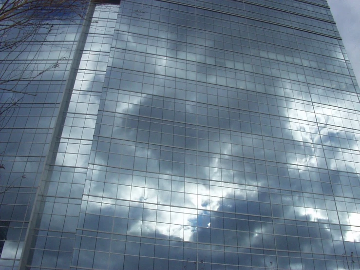 the reflection of clouds in a large building