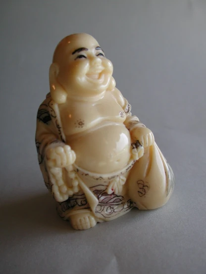 a little ceramic figurine sitting on the table