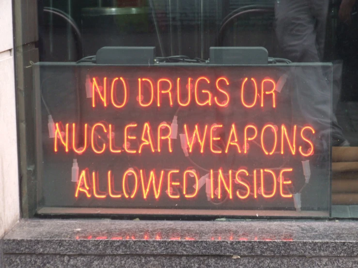 there is a sign that reads, no  or nuclear weapons allowed inside