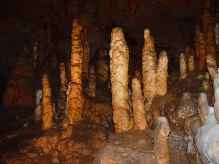a number of pillars inside of a small cave