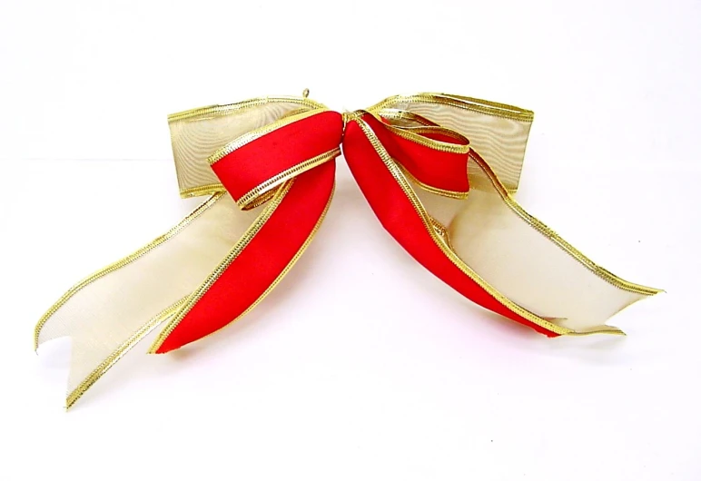 gold and red ribbon on white background