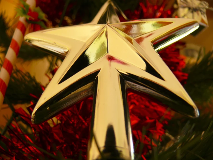 the star decoration on the christmas tree is elegant