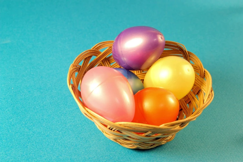 a group of balloons sitting in a basket