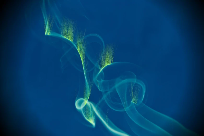 an artistic po with blue and green smoke