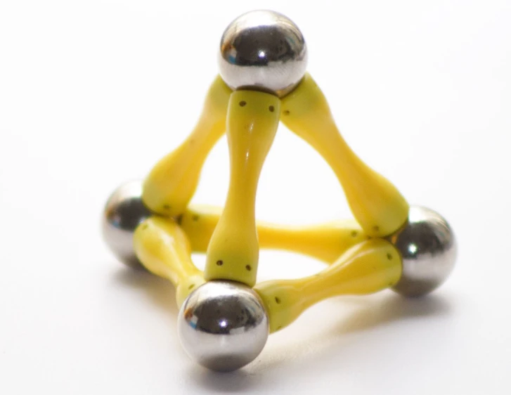 this is a ring made of beads and yellow rubber