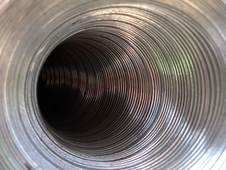 the inside of a metal pipe looking up