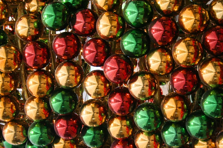 a christmas ornament, with colored or green and gold ornaments