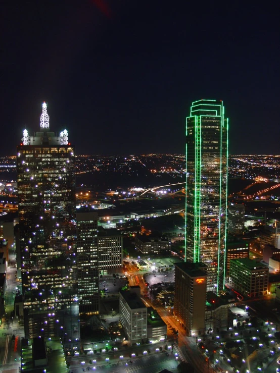 a night view of a city skyline with lights in the background