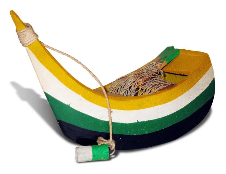 a small wooden boat with multicolored paint and rope