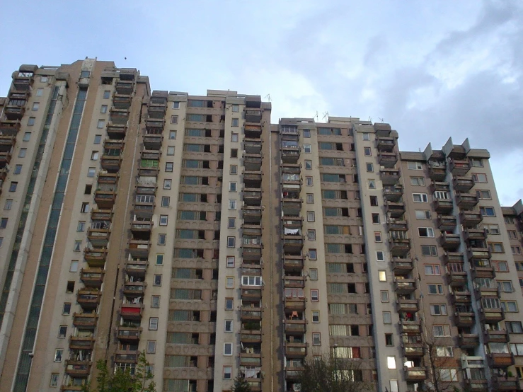 the tall apartment buildings have balconies and balconies