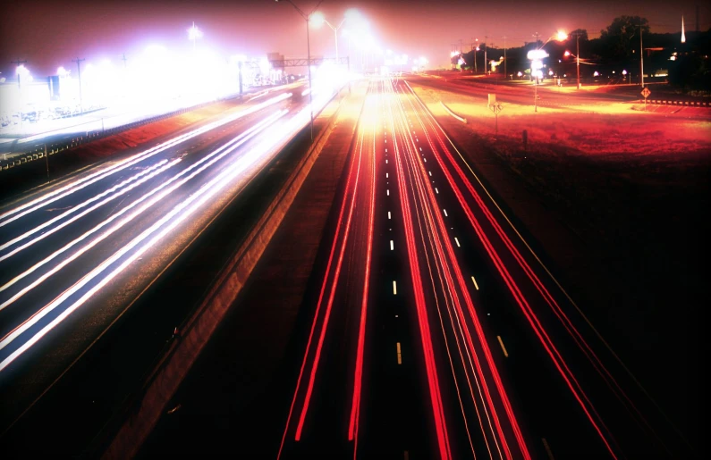 a couple of street lights are in the night sky