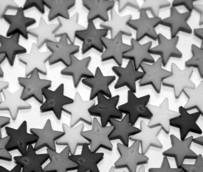 black and white stars scattered out in a pile