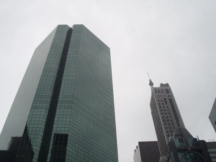 several different types of buildings are shown against a gray sky