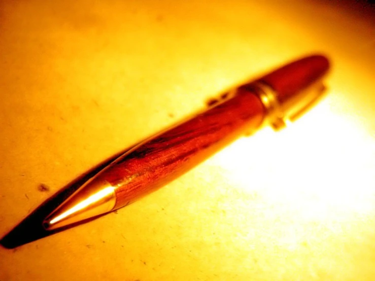 a wooden pen on a yellow table in a room