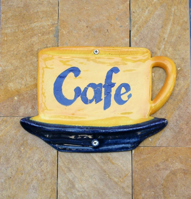 a close up of a ceramic coffee mug shaped object