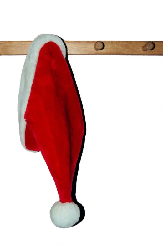 a santa hat and tie hanging on a pole