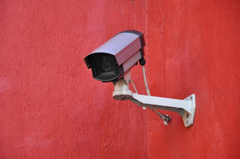 a security camera on the side of a building