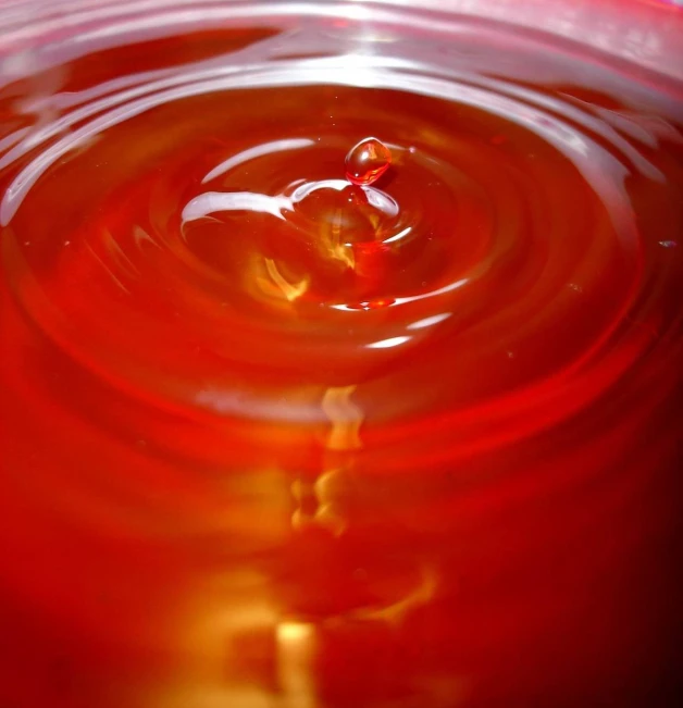 a small water drop on the surface of the bowl