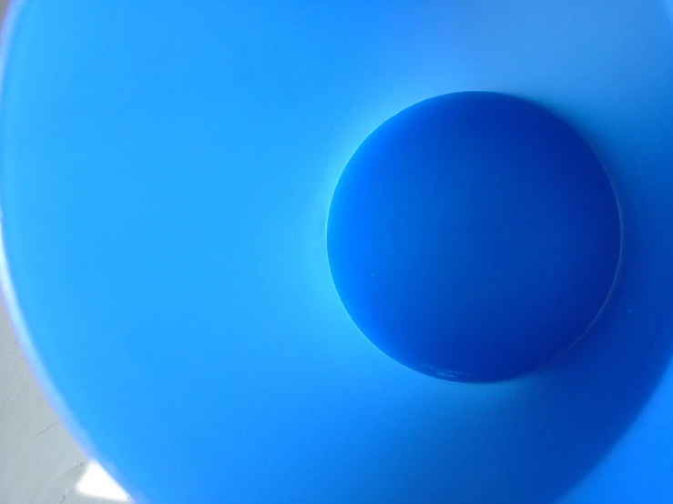 the big blue object is standing in the sunlight