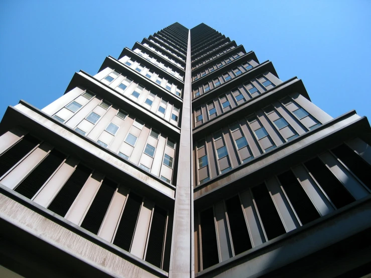 a tall building with black and white lines on the side