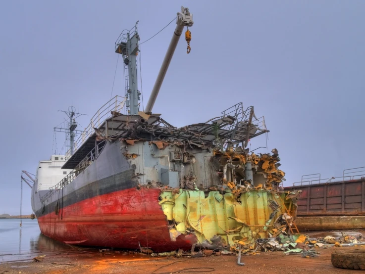 a large rusted ship in the water