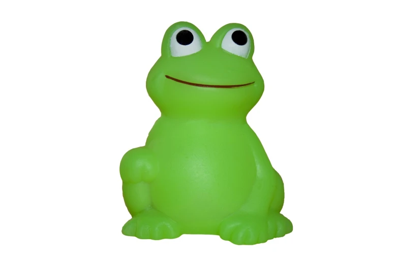 a large plastic frog with eyes sitting down