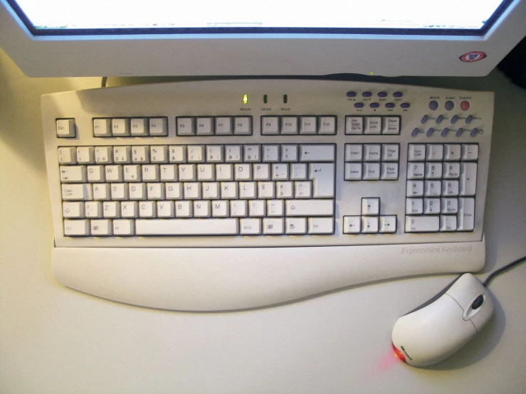 a computer mouse and keyboard with sunlight shining