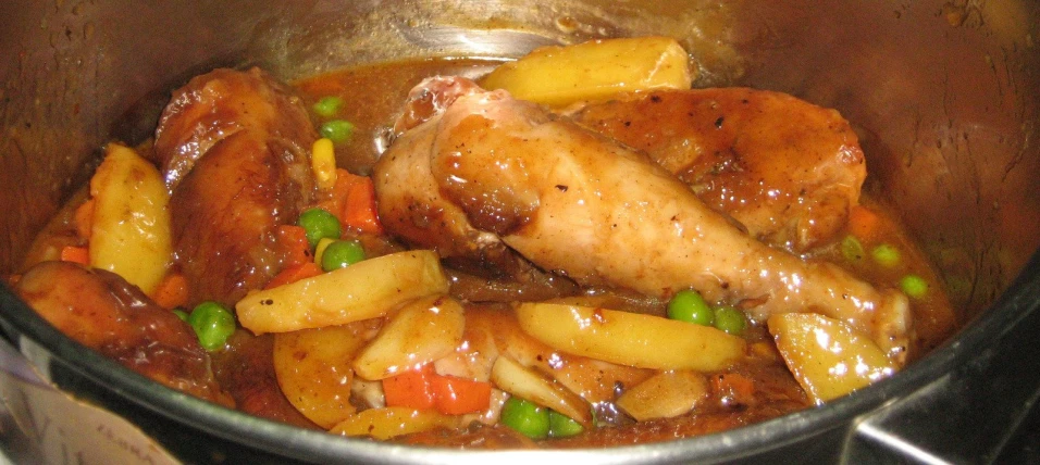 this is an image of cooked chicken and vegetables in the pan