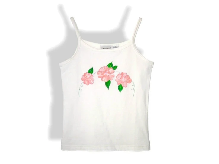 a white t shirt with pink flowers on it