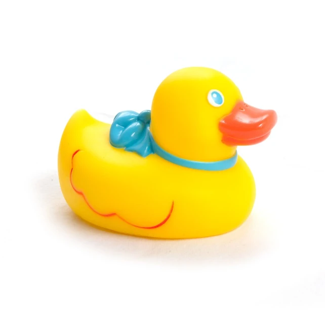 a rubber ducky with a blue bow on its head