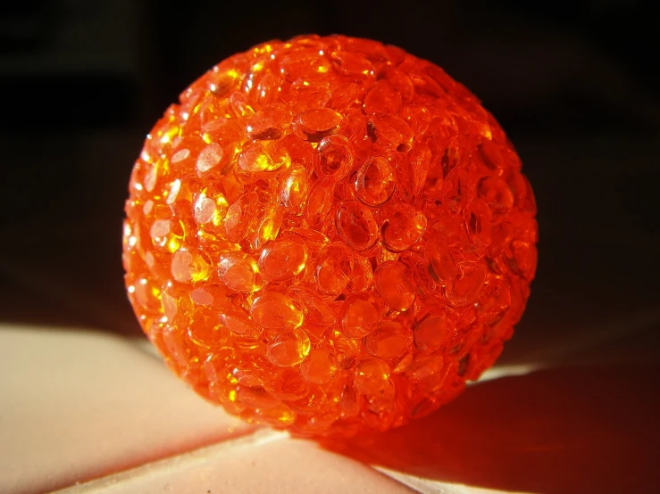 an orange object is displayed on a table