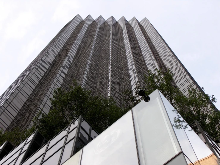 a tall building with many windows and trees