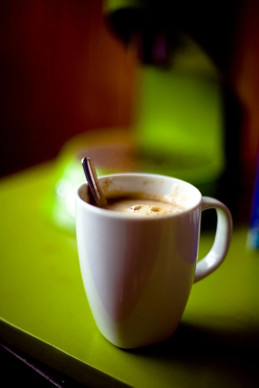 a cappuccino cup is sitting on the table