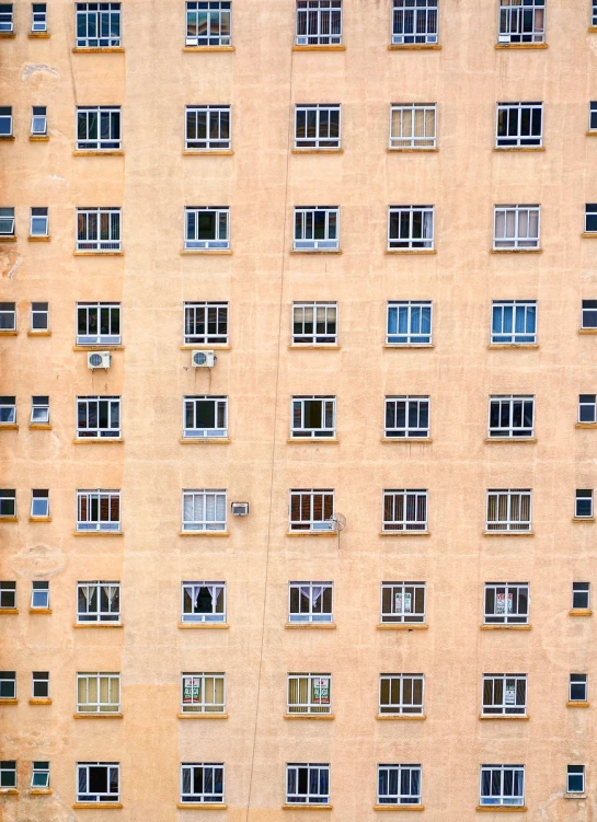a tall building with many windows on each of it