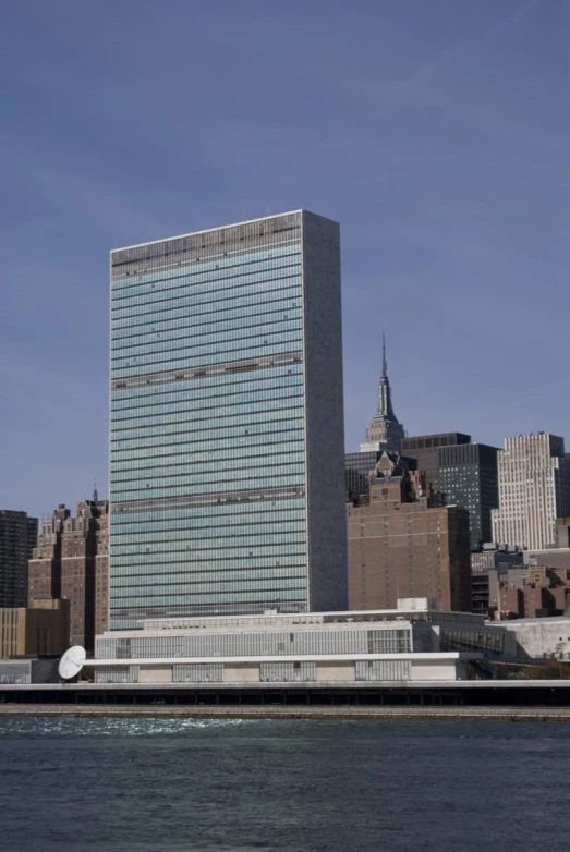 a tall building surrounded by buildings in a large city