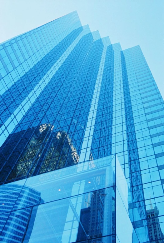 a high rise building has several glass windows