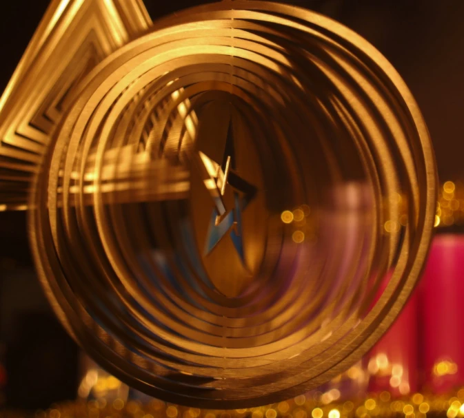 an interesting clock sitting on top of a glass