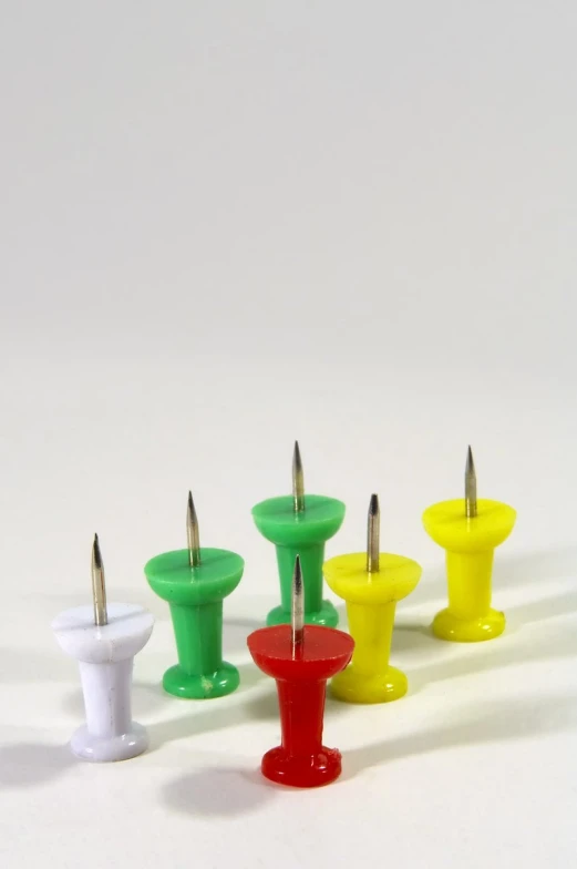 four small candles with different colors and designs