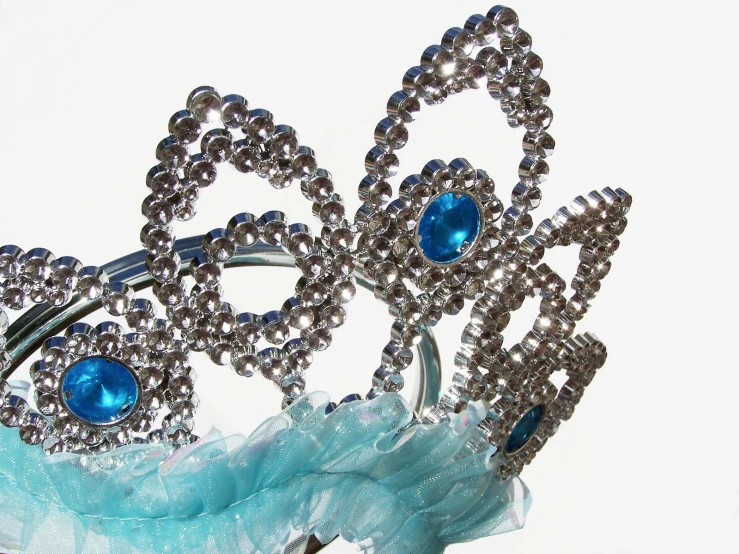 a tiara sitting on top of a blue table