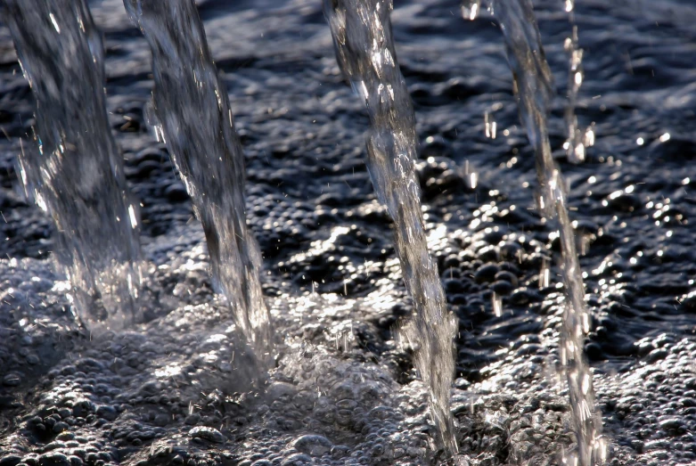 water flowing from a pipe on a river