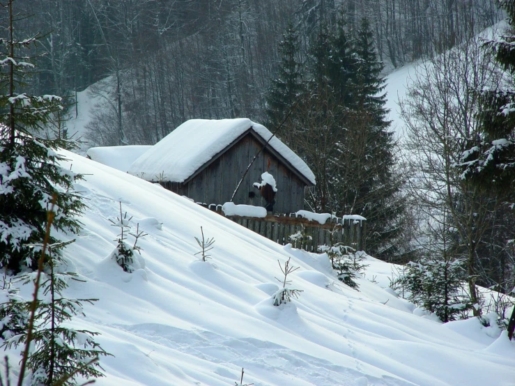 a ski lodge is covered by a large amount of snow