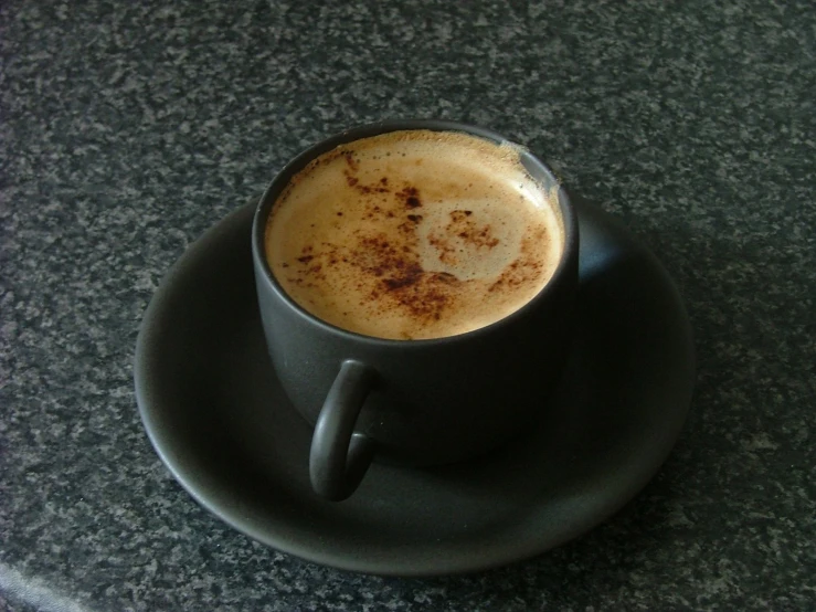 a close up s of an upside down cup on a saucer