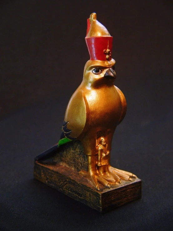 a decorative ss bird with a red hat