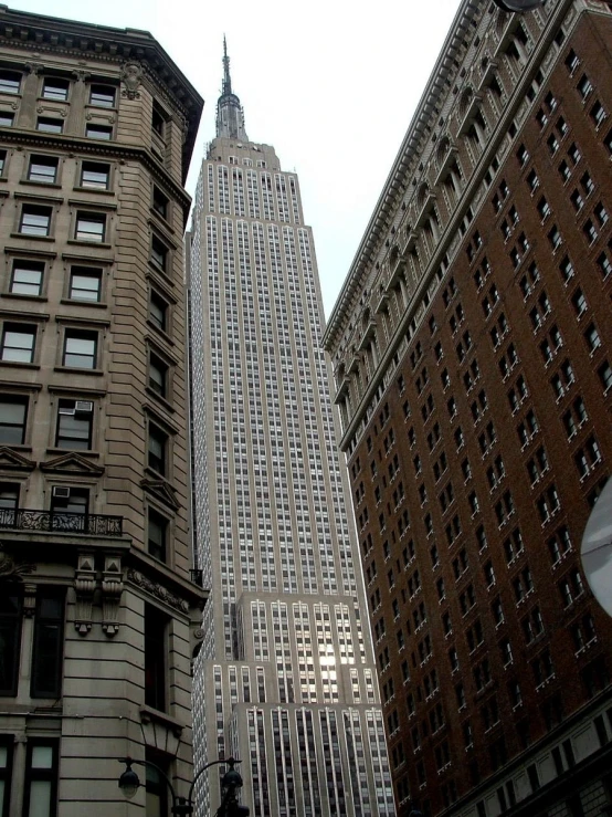 a street view shows tall buildings on either side