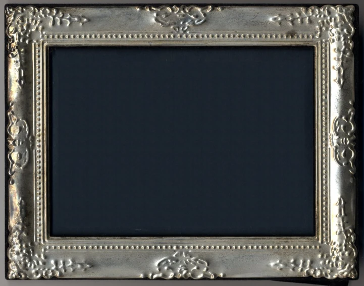 an empty picture frame on the wall