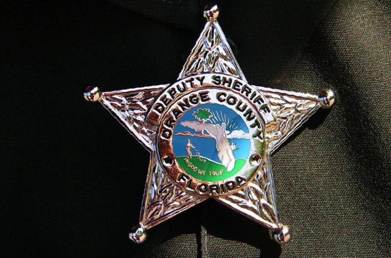 an emblem on the neck of a sheriff badge