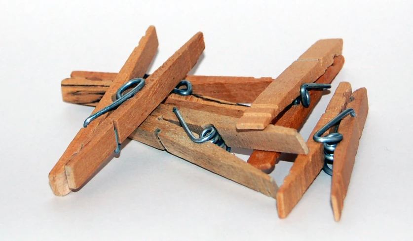 the wooden plane is tied to the metal chain